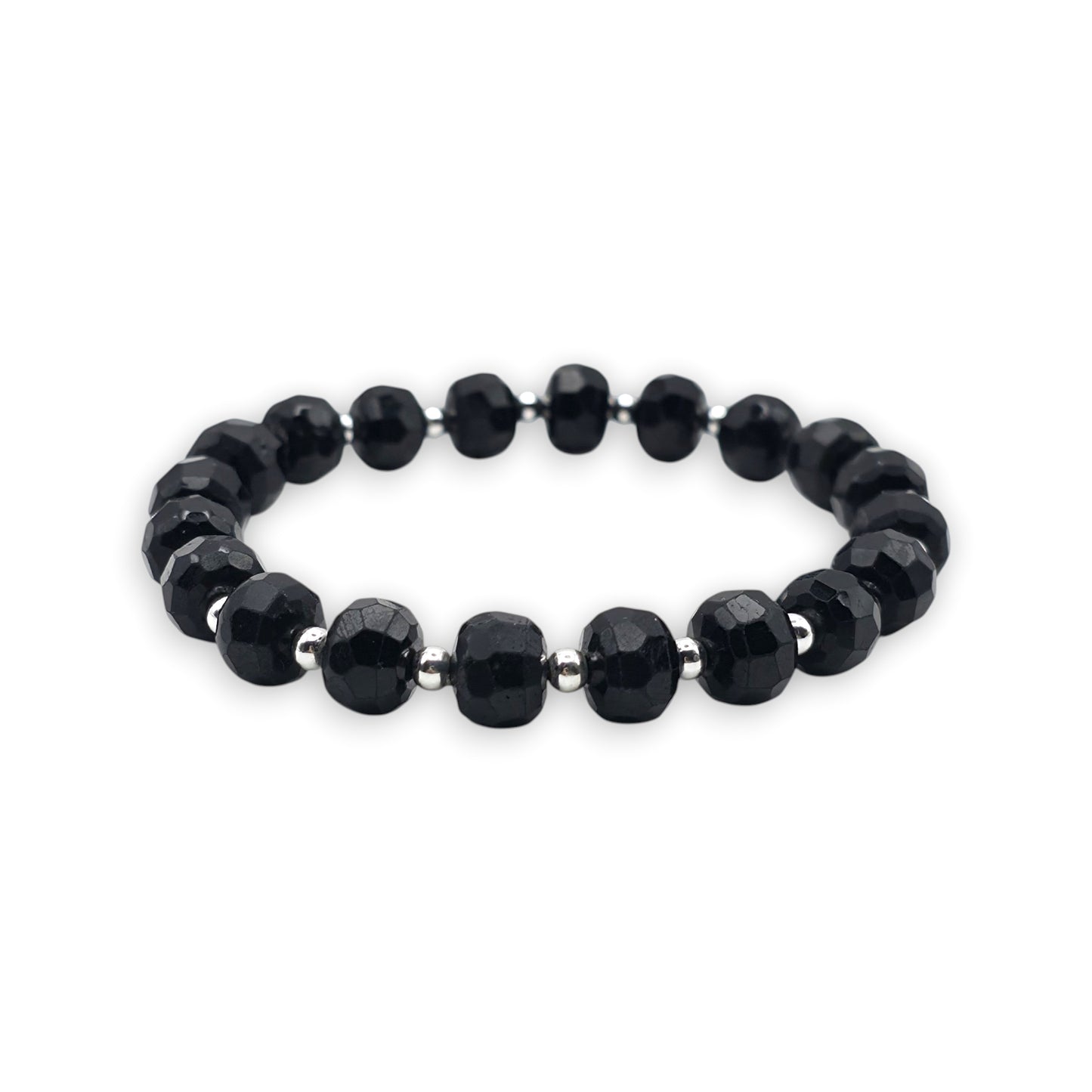 A beaded stretch bracelet featuring faceted Black Tourmaline beads separated by small silver spacer beads, shown against a plain white background.