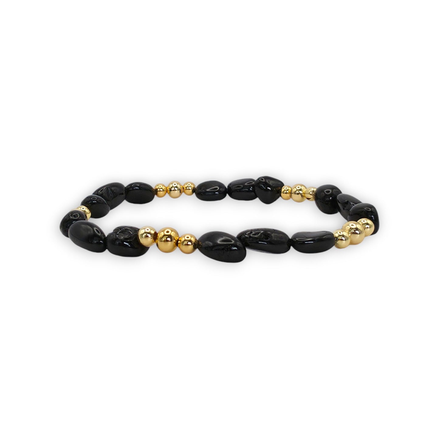 A beaded stretch bracelet featuring Black Onyx beads and polished gold spacer beads, displayed on a clean white background.