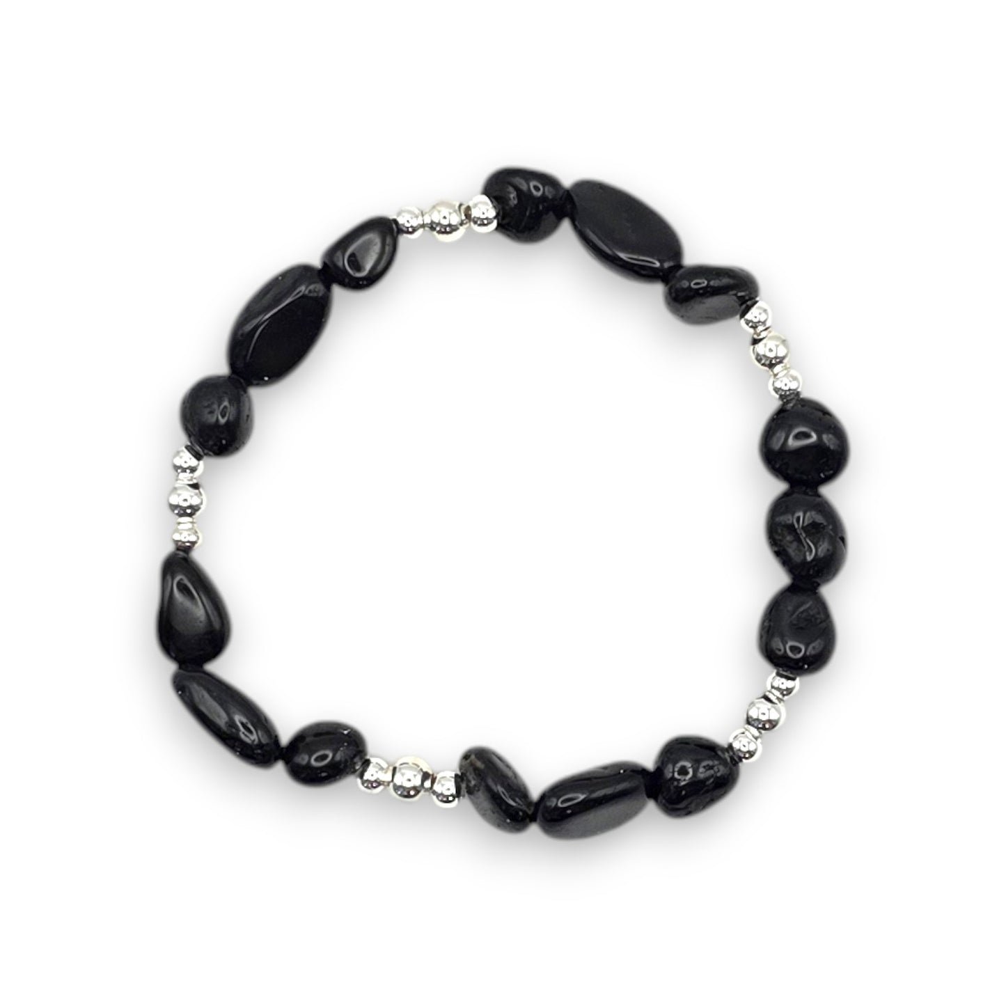 A beaded stretch bracelet featuring Black Onyx nugget beads separated by small silver metallic spacer beads, displayed on a clean white background.