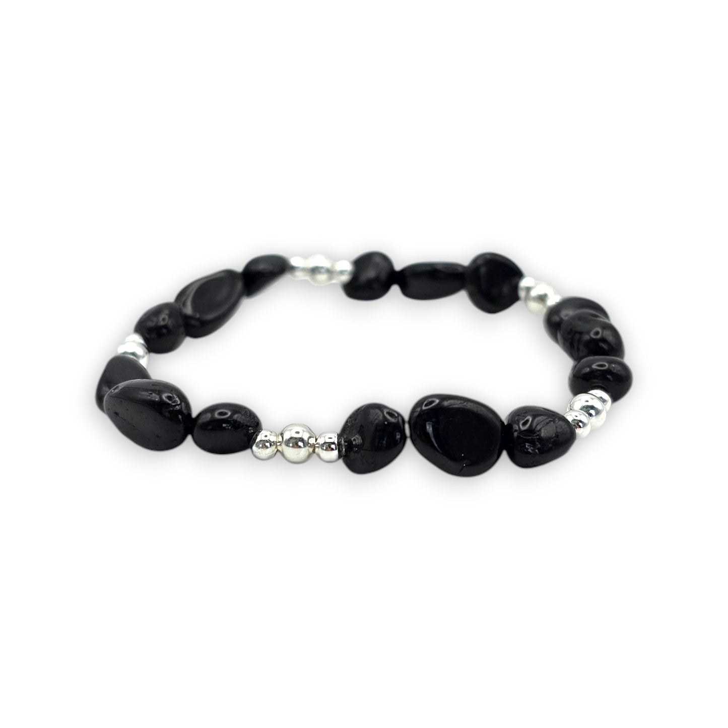A beaded stretch bracelet featuring Black Onyx nugget beads and small silver spacer beads, displayed on a clean white background.