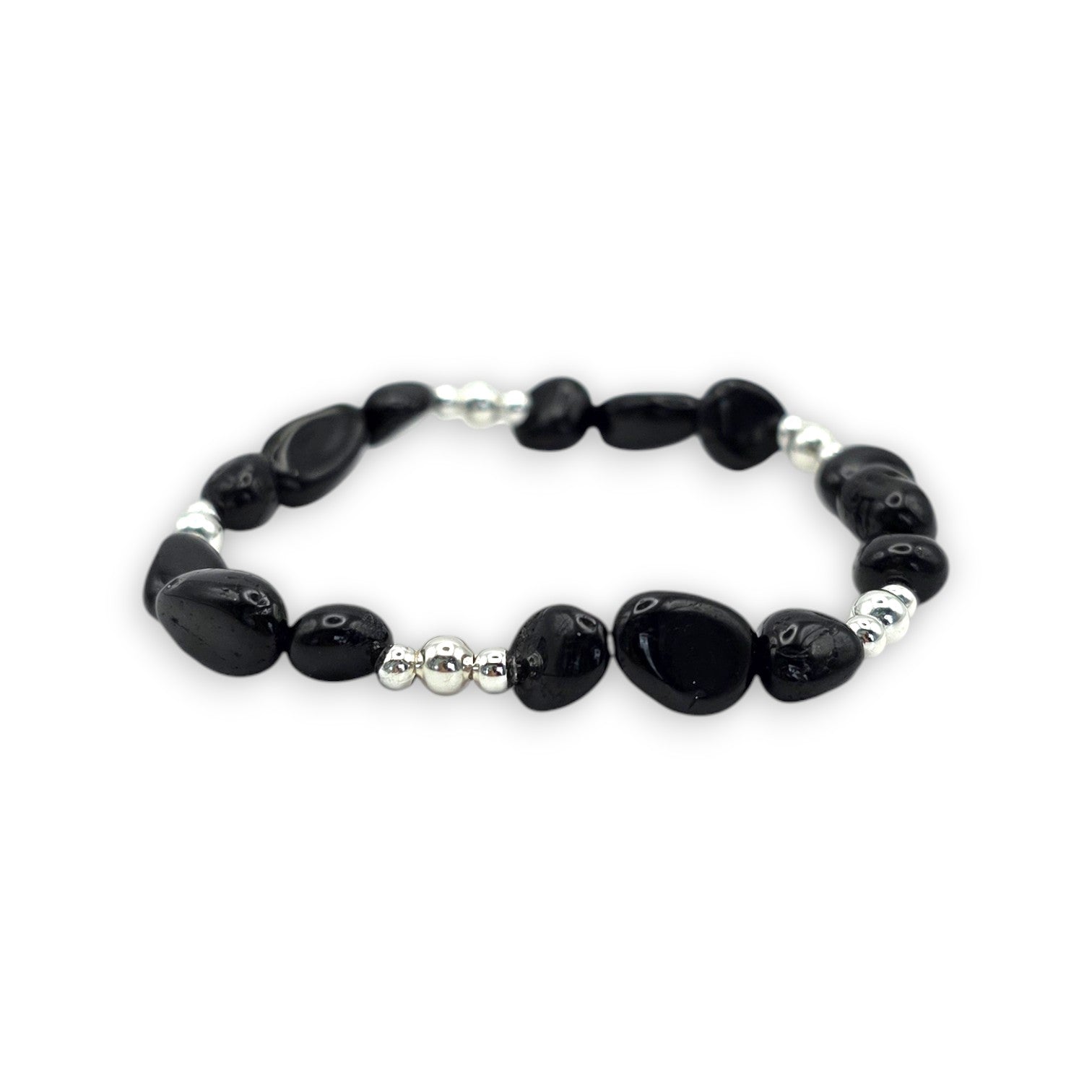 A beaded stretch bracelet featuring Black Onyx nugget beads and small silver spacer beads, displayed on a clean white background.