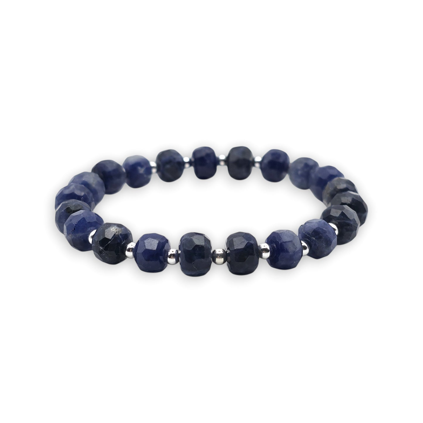 A beaded stretch bracelet made of blue Sodalite faceted beads separated by small silver spacer beads, shown on a plain white background.