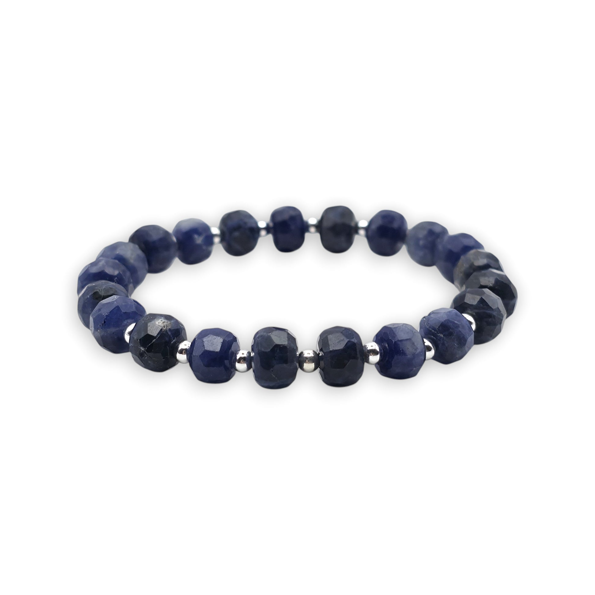 A beaded stretch bracelet made of blue Sodalite faceted beads separated by small silver spacer beads, shown on a plain white background.