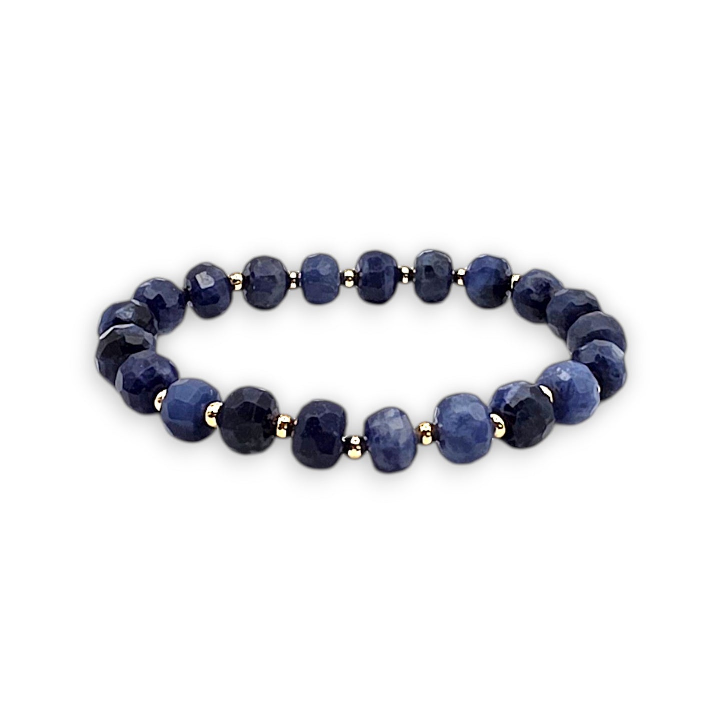 A beaded stretch bracelet made of blue Sodalite faceted beads separated by small gold spacer beads, shown on a plain white background.
