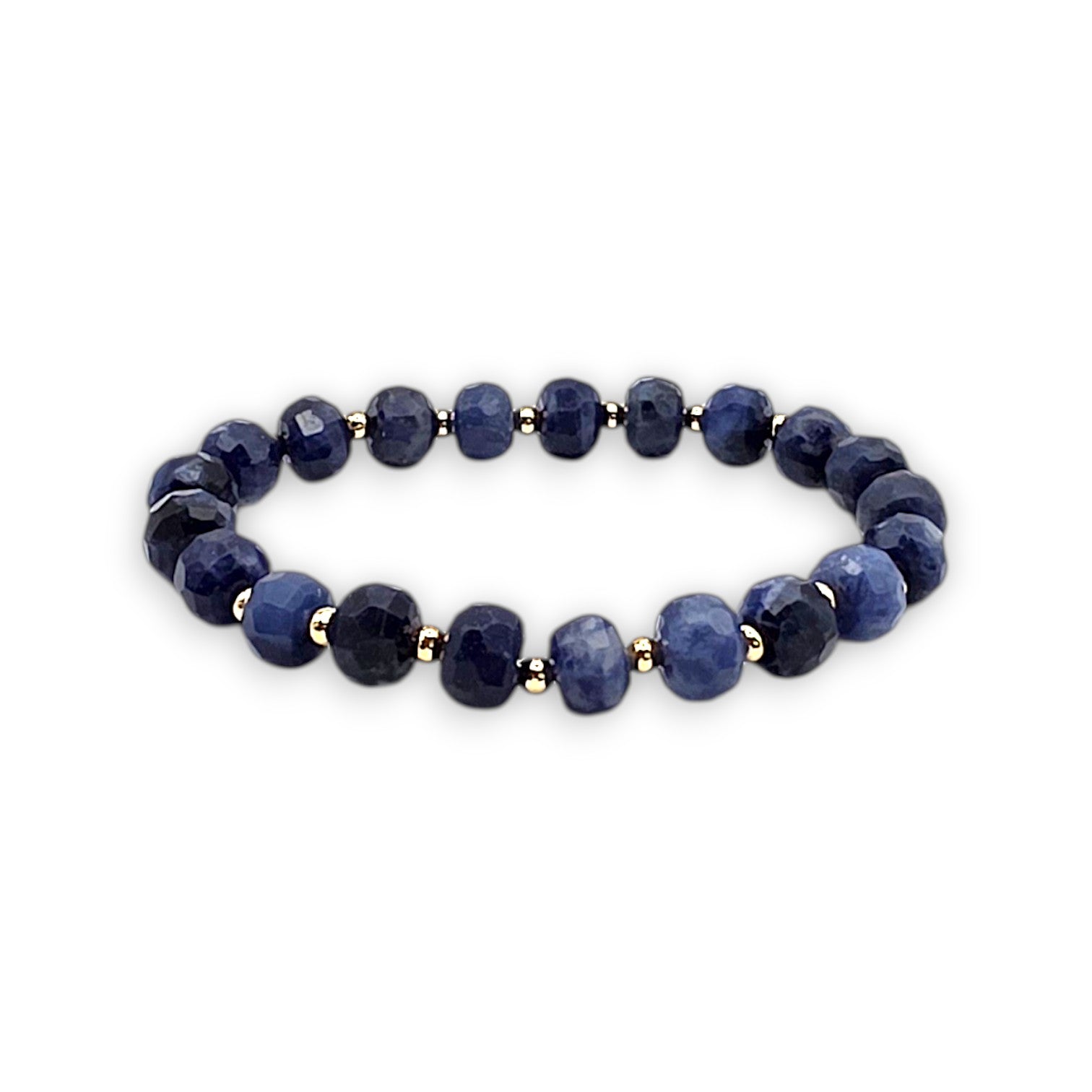 A beaded stretch bracelet made of blue Sodalite faceted beads separated by small gold spacer beads, shown on a plain white background.